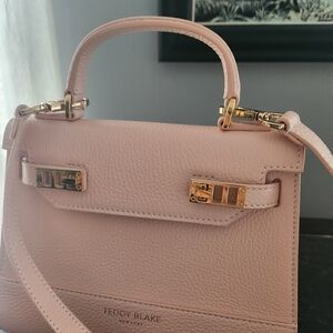 Teddy Blake Crossbody at the base 9" wide, 7" high, and 3" deep